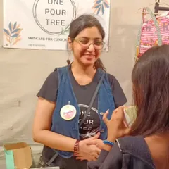 A candid moment of me chatting with a customer at the Golden Spiral Fair. Answering your questions and helping you find the perfect product for your skin is one of my favorite things to do.
