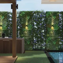 This view highlights the vertical garden with integrated lighting, which creates a dramatic effect at night. The design also incorporates a plunge pool, turning this Khar terrace into a private resort.