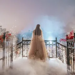 A bride’s entrance should be nothing short of magical. I use elements like ethereal smoke and sparkling fountains to create a dramatic reveal, making her walk towards the mandap an unforgettable vision.