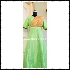 This full-length view shows a custom-made long gown in a lovely light green silk. I designed this piece with an attached, pre-draped dupatta in a contrasting print, so your little one gets a sophisticated look without any fuss. It’s a perfect example of a comfortable, one-piece occasion wear outfit.