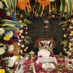 The beautifully decorated stage for a Rupaande Maa Pahedi performance at Yogi Sabhagrah. The sacred setup with flowers and the deity's image creates the perfect atmosphere for a night of devotion.