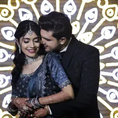 Another beautiful shot from the same event, with the decorative background adding a touch of grandeur.