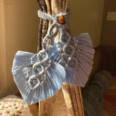 Another look at our macrame leaf curtain tie-backs, catching the beautiful sunlight. These small details can truly elevate the look of a room.