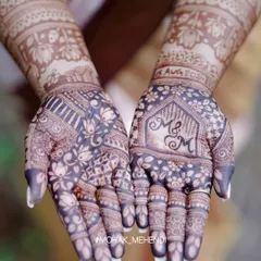 The final result is everything. A deep, rich henna stain is the sign of pure, natural paste and proper technique, something I ensure every student learns to master. This design beautifully incorporates the couple's initials.