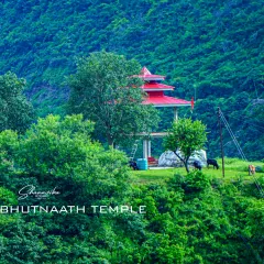 A view of the Kawanti Bhutnaath temple nestled in the lush green hills. This shot captures the serene environment and how the temple is a natural part of the surrounding landscape.