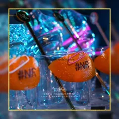 We can even personalize the garnish! Here, we've carefully stamped the couple's initials onto an orange peel, a unique detail that shows how much we care about your story.