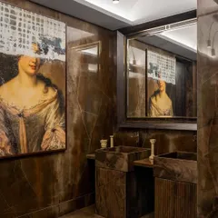 Indulge in opulent sophistication with this Victorian-inspired bathroom retreat. Featuring his and her sinks with exquisite fluted detailing, this monochromatic marvel exudes timeless elegance and refinement.