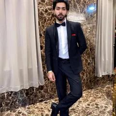 A classic and confident look. This client is rocking a timeless black tuxedo with a bow tie, a perfect rental for any formal occasion.