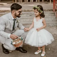 A truly angelic flower girl dress for those unforgettable wedding moments. This white tulle frock is light, airy, and designed for comfort, ensuring she feels as special as the occasion itself.