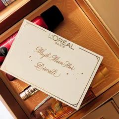 The final personalized card, "Mujh Mein Hai Diwali," nestled in a L'Oréal gift box. It’s about creating a complete, beautiful experience from the product to the packaging.