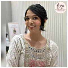Another look at this classic and elegant updo. It's a versatile style that is perfect for weddings, festivals, or any formal event.
