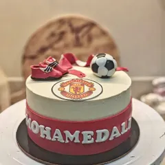 Another shot of the Manchester United cake, showing the clean lines and carefully placed fondant details.