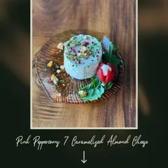 I love making a single ingredient the star of the show. Here is my signature Pink Peppercorn and Caramelized Almond Cheese, a housemade creation that is creamy, sweet, and a little bold, garnished with a fresh strawberry.