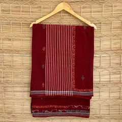 A rich maroon handloom saree from our Chikankari series. The combination of woven stripes and delicate embroidery makes this a timeless piece of wearable art.