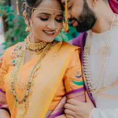 This is the kind of moment I live to capture. An intimate, unposed portrait of a Maharashtrian couple, lost in their own world. The delicate mundavalya and traditional jewelry complete the frame.