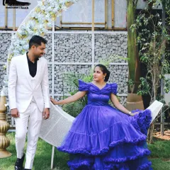 A fairytale pre-wedding shoot at my indoor studio. The groom's sharp white suit and the bride's voluminous blue gown, both available for rent, create a magical scene against our moon prop.