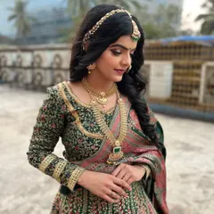 The final result of my seminar demonstration. This subtle yet royal look features soft, defined eyes and a regal green and pink lehenga.