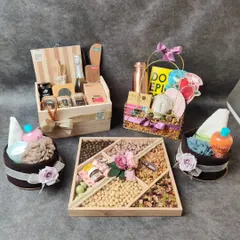 Not sure what to gift for a housewarming? We can help. This image shows a collection of housewarming hampers we created, including dry fruit platters and home spa kits.