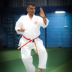 A demonstration of a classic Karate stance and block. Every movement is practiced to perfection, building muscle memory and flawless form.