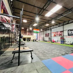 A wide view of our training floor at Adapt Fitness Club. We have plenty of open space for group classes, weightlifting platforms, and all the functional training equipment you need.