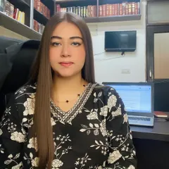 At my desk, where I draft legal documents and prepare case strategies. The principle of "Dharmo Rakshati Rakshitah" (the law protects those who protect the law) guides my work.