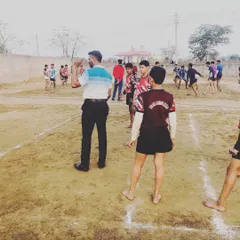 Coaching is about teaching and guiding. Here I am on the ground, instructing our young players on the fundamentals of the game.