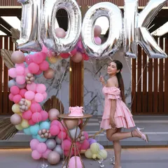 I was thrilled to create the cake and balloon decor for this influencer's 100k followers celebration. The pastel pinks, blues, and golds created a dreamy, celebratory atmosphere.