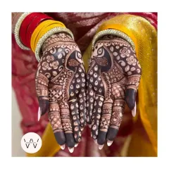The beauty of a rich, dark henna stain is unmatched. This engagement look features bold peacock designs, a symbol of grace and beauty, which really came to life with this gorgeous color.