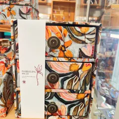 A close-up of the 'Darjeeling Sway' three-drawer organizer. The antique-style knobs add a touch of vintage charm to the vibrant floral cotton fabric.