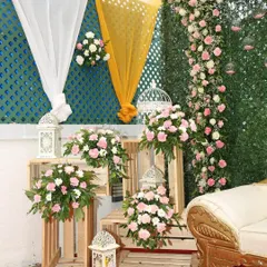 A close-up of the decor for an intimate wedding. We used wooden crates, lanterns, and beautiful pink and white floral arrangements to create a charming and rustic corner piece.