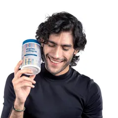 A lifestyle portrait of a male model with the marine collagen product. This image helps the brand connect with a broader audience, showing that wellness and skincare are for everyone.