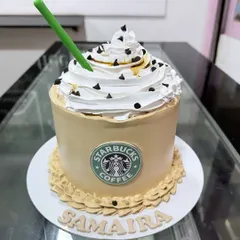 This cake is sculpted to look exactly like a Starbucks Frappuccino, complete with the iconic green straw and logo. It shows how I can replicate popular products for a fun, themed celebration cake.