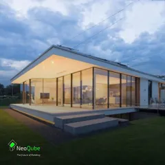 This concept showcases a single-story home with curved glass walls, creating a panoramic view of the outdoors. It demonstrates the flexibility of our building system to create unique architectural forms.