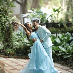 We believe in capturing the quiet, playful moments just as much as the grand ones. This romantic dip amidst a lush garden setting showcases the beautiful chemistry of our couple during their pre-wedding brunch.