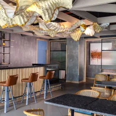 This bar and lounge area features furniture crafted by our DCA Workshop. We blend innovative design with local talent to create sophisticated pieces that stand apart from mass-produced options, reflecting our commitment to precision and conscious creation.