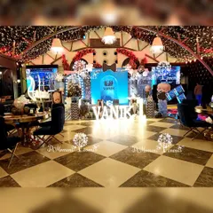 I transform entire venues to perfectly match your chosen theme. This wide-angle view of a "Boss Baby" party shows how every element, from the stage and lighting to the guest seating and ceiling decor, works together to create a cohesive and luxurious party experience.