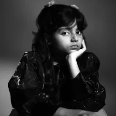 A striking black and white portrait of child actor Pahal Chaudhary. In the studio, I use dramatic lighting to capture the personality and confidence of the children I photograph, creating timeless kids' portraits.