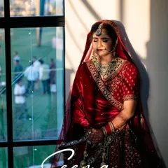 A serene bridal portrait captured in the soft, natural light from a window, creating a beautiful and timeless image.