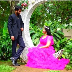 Feel like royalty in this hot pink ruffled ball gown. The voluminous skirt and vibrant color make it a showstopper, perfect for a fairytale-themed pre-wedding or maternity shoot.