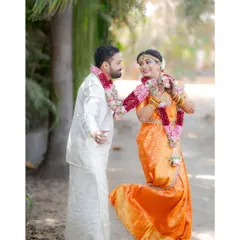 A playful and fun shot of the couple, with the bride kicking up her heel, showcasing their joyful personalities.