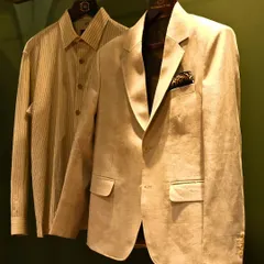 This lightweight linen jacket, paired with a striped shirt, is an example of relaxed sophistication. The clean lines and natural fabric make it a versatile piece, perfectly tailored for comfort and style.