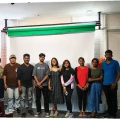 A group photo with the wonderful students and staff at the OMC Modeling Institute after our session on mental well-being and Face Yoga.