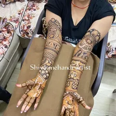 A full-sleeve design filled with classic Indian art elements. It features a bride in a doli, elephants, peacocks, and intricate geometric patterns.