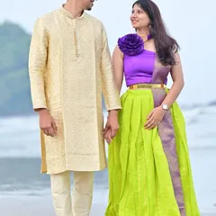 For a traditional look, this groom-to-be chose a classic cream-colored silk kurta set for his beach pre-wedding shoot.