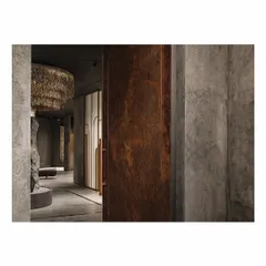 At the entrance of the 'Frozen' store, visitors are greeted by a 12-foot-tall copper-clad door. The monumental scale of the door visually heightens the space and sets a dramatic, intriguing tone for the retail experience that lies within.
