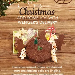 This is what our Christmas spirit looks like. A festive spread featuring our rich plum cake, gingerbread men, star-shaped cookies, and jam-filled Christmas tree cookies, all ready for Santa's arrival.