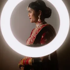 A creative and modern bridal portrait using a ring light to create a stunning halo effect.