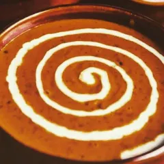 My special Dal Makhani is slow-cooked for hours to get that incredibly creamy and rich texture. It's a staple of North Indian cuisine and a must-have for any authentic vegetarian feast.