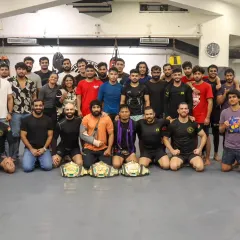 We are a team, a family, a wolfpack. This is our competition team, proudly displaying the championship belts earned through blood and sweat. When you train with us, you train alongside champions and are backed by a team that has your back, always.