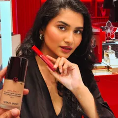 A close-up shot from the Armani Beauty store launch, featuring their Power Fabric foundation and a lip color. I create content that highlights product details in a glamorous setting.